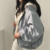 Αναστρέψιμο μπουφάν με κουκούλα από μαλλί teddy